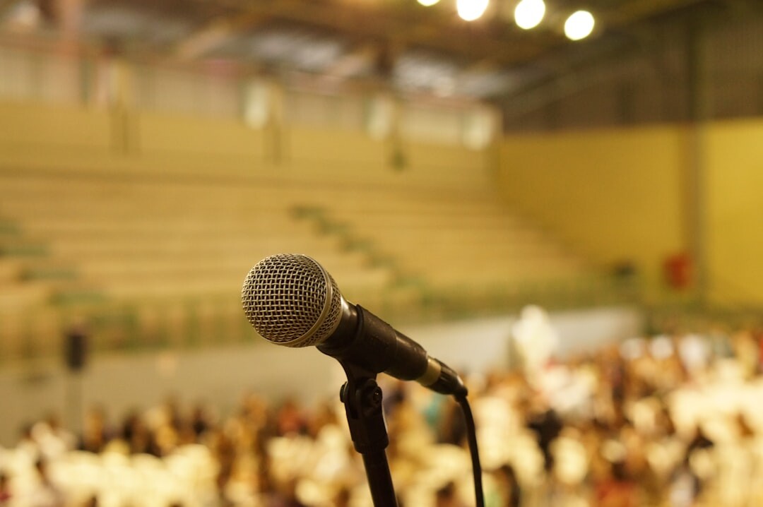 speaker on stage with microphone
