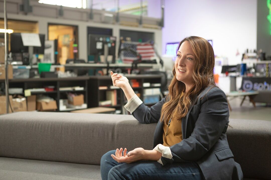 person gesturing while speaking